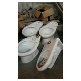 Group of Sloan toilets one does have damage