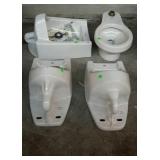 Group of three urinals, two are zurn, and one is