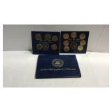 Two presidential coin sets in brass and a empty