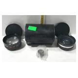 Yashica camera lenses in leather case. One is