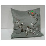 Decorative throw pillow with birds on a branch