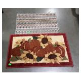 Two throw rugs - on is Fall decor style