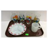 Four smurf glasses, fire king coffee mug, and