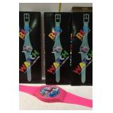 Four "Big watch" plastic battery operated wall