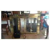 Brass and glass bifold doors fireplace screen
