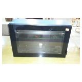 Black show case, with glass front, and one glass