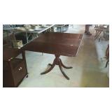 Drop-leaf pedestal table with two drawers has