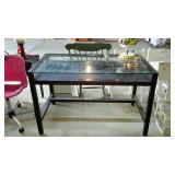 Designers Table, has glass pane top over board