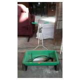 Lawn spreader with a mini grease gun