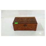 Carved dresser box filled with watches and