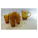 Amber glass water pitcher and seven tumblers