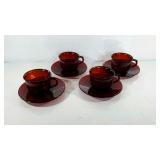 Ruby red glass cups and saucers