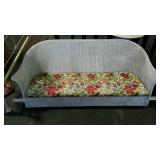 White wicker porch swing, measures 65 inches long