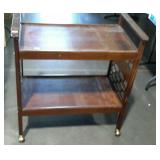 Wooden cart on wheels, measures 31 inches long,