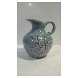 Redwing pottery pitcher. Blue outside with pink