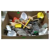 Large flat of kitchen tools and utensils.