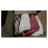 Box of used towels and washclothes.