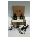 Cigar box and two microphones with stands.