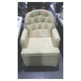 Swivel rocking chair with yellow upholstery, from