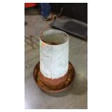 Galvanized chicken waterer has some rust
