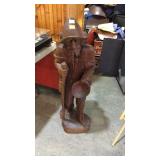 Wooden statue carved of man 44in tall has a piece