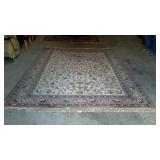 Large room rug with pink border, does have flower