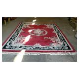 Large oriental wool rug measures 150 inches long,