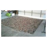 Multi colored large wool rug, does need to be