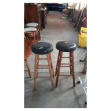 Two home counter bar type stools, with the black