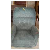 Teal colored upholstered rocker recliner - needs