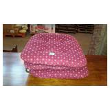 Three burgundy chair cushions with white floral
