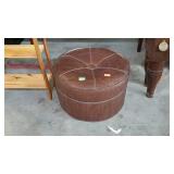 Hassock on wheels. Brown vinyl. 18" diameter, 13"