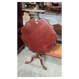 Tilt top tea table with carved legs scalloped