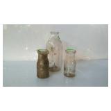 Three dairy bottles - one quart size embossed