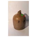 Stoneware jug, has dripped glaze design on side -
