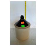 One gallon brown over white stoneware jug - chips