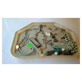 Tray lot of costume jewelry, a harmonica, etc,