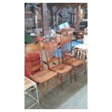 Three old oak press back dining chairs, one armed