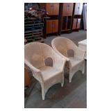 Pair of early wicker sunroom chairs off whitish