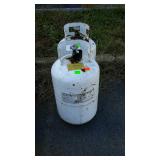 Two propane tanks empty both are a little bigger,