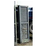 Pair of wooden louvered shudders, 15 x 63" show