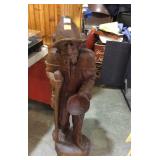 Wooden statue carved of man 44in tall has a piece