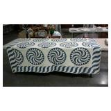 Blue and white quilt has staining and damage