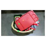 Basket with crotchet throws and a plastic bed