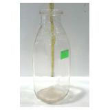 Quart dairy bottle, embossed Farmer Owned