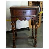 Single drawer stand with scrolled apron and turned