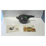 Hawkins pressure cooker with two books