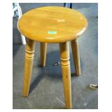 Low four legged stool. 12" diameter, 17" high.