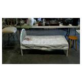 Metal framed toddler bed with evenflo mattress,