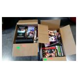 Two boxes of VHS tapes. Lots of scary movies in